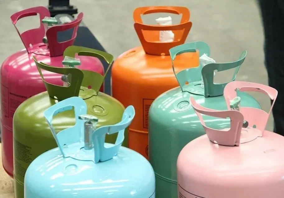 Colorful gas cylinders arranged in a group.
